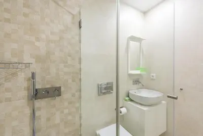 a sink with water running from a faucet at GuestReady - Gemini Apartment in Porto