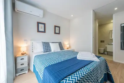 a living room with a couch and a table at GuestReady - Gemini Apartment in Porto