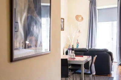 a living room with a couch and a table at GuestReady - Minimalistic studio downtown in Porto