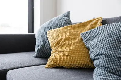 a group of pillows sitting on a couch at GuestReady - Cosy spot near Porto city centre in Porto