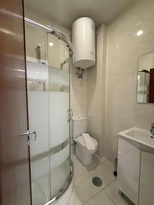 a bathroom with a shower and a toilet and a sink at ML Apartments Almada panoramic balcony in Porto