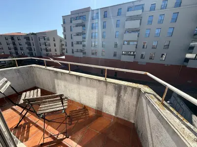 a bench sitting on top of a building at ML Apartments Almada panoramic balcony in Porto