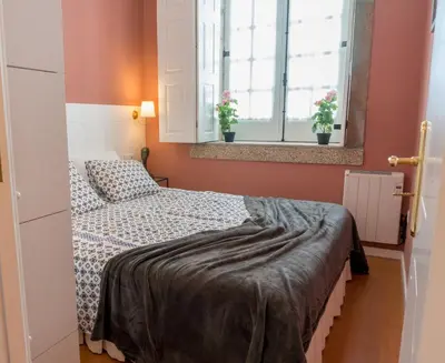 a bathroom with two sinks and a mirror at Oporto Center Clean & Cozy Apt 3 in Porto