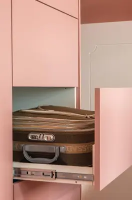 a suitcase is sitting inside of a cabinet at Oporto Center Clean & Cozy Apt 4th floor in Porto