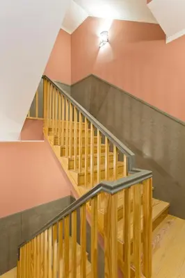 a staircase in a house with wooden railings at Oporto Center Clean & Cozy Apt 4th floor in Porto