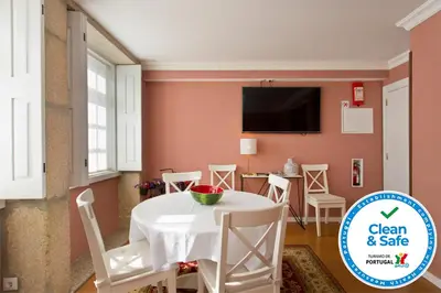an old building with a turret on a hill at Oporto Centre Clean & Cozy Apt 1 in Porto