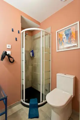 a bedroom with a bed with white sheets and pillows at Oporto Centre Clean & Cozy Apt 1 in Porto