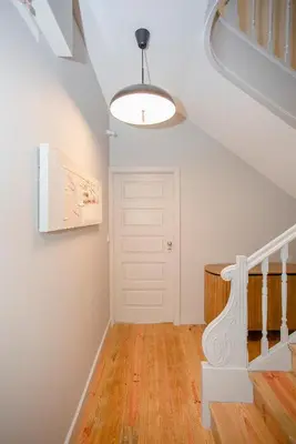 a staircase in a house with a white ceiling at Liiiving in Porto - Historic Clérigos Apartments in Porto