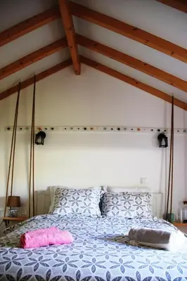 a bedroom with a bed with two pillows at Loft Mártires in Porto