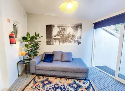 a living room with a couch and a table at Bluetile Sol Apartment in Porto