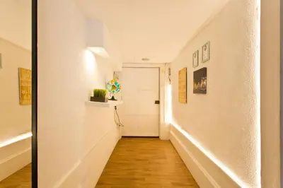 a hallway with white walls and a white door at Oporto Blue Picaria - Unique Citycenter Apartment in Porto