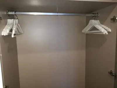 a bathroom with two hangers and a mirror at Porto Tropical Charm in Porto