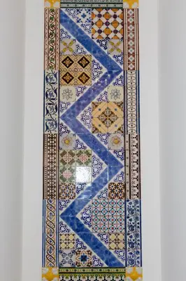 a rug with patterns on it on a wall at Casa Velha Guesthouse in Porto