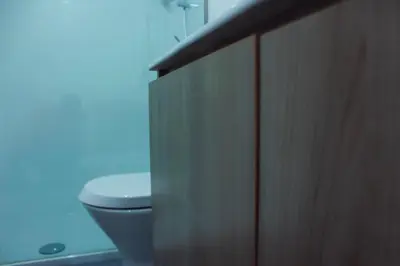 a bathroom with a toilet and a shower stall at Apartamento da Lapa in Porto