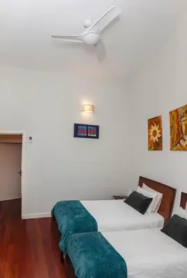 a bedroom with two beds and a ceiling fan at Bonjardim Terrace in Porto