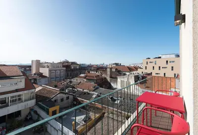 a view of a city from a balcony at BmyGuest - Porto Design Central Apartment in Porto