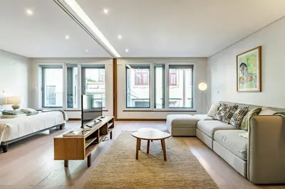 a living room with a couch and a table at Art & Design Apartment Oporto in Porto