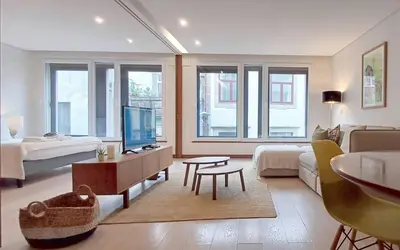 a bedroom with a bed and a large window at Art & Design Apartment Oporto in Porto
