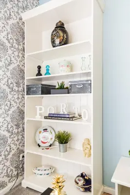 a white shelf in a room with plates and dishes at Porto Downtown Apartment in Porto