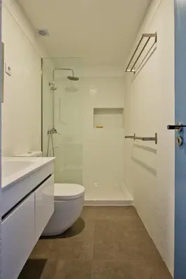 a bathroom with a toilet and a sink and a shower at Oliveirinhas Porto Apartment in Porto