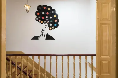 a bunch of balloons on a wall next to a staircase at BmyGuest - 156 Trindade House & Terrace in Porto