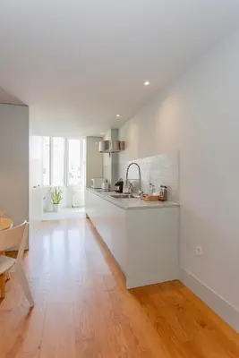 a living room with a couch and a tv and a table at Liiiving in Porto - Santa Catarina Luxury Apartment in Porto