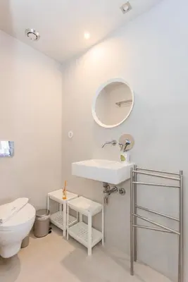 a bathroom with a white sink and a toilet at Liiiving in Porto - Santa Catarina Luxury Apartment in Porto