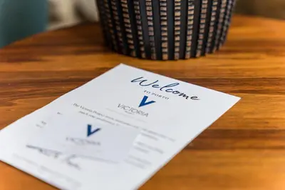 a piece of paper sitting on top of a table at Victoria Project - Apartments - Private Parking in Porto