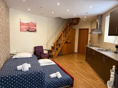 a small room with two beds and a staircase at Peter Residence - Rio Douro & Caves Vinho do Porto in Vila Nova de Gaia