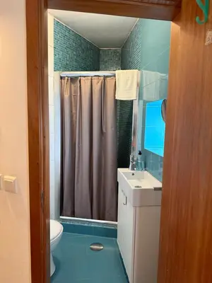 a bathroom with a shower and a toilet and a sink at Peter Residence - Rio Douro & Caves Vinho do Porto in Vila Nova de Gaia