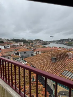 a view of a city from a balcony at Peter Residence - Rio Douro & Caves Vinho do Porto in Vila Nova de Gaia