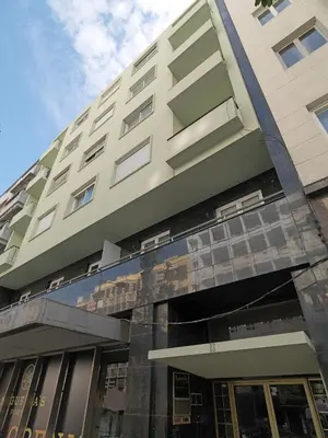a tall building with windows on the side of it at FLH Porto Central Apartment in Porto