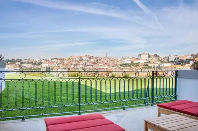 a balcony with a view of a city at The Yeatman in Vila Nova de Gaia
