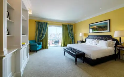 a bedroom with a large bed and a large window at The Yeatman in Vila Nova de Gaia