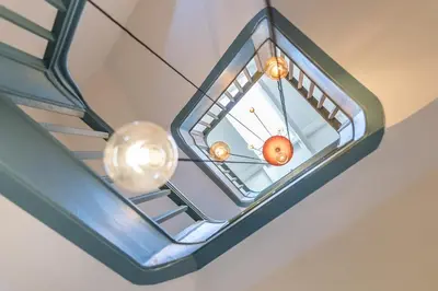 a glass ceiling with two lights on it at Casa do Ofício - Caldeireiro in Porto