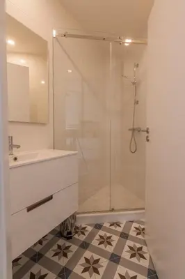 a bathroom with a shower and a sink at Secret Camões in Porto