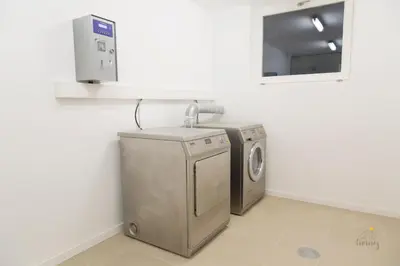a laundry room with a washing machine and a mirror at Oporto Ceuta Residences - Residence 2 by We Do Living in Porto