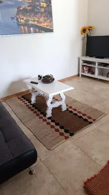 a white coffee table in a living room at Portus Ribeira House in Vila Nova de Gaia