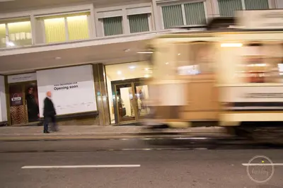 a man walking on the sidewalk in front of a store at Oporto Ceuta Residences - Residence 8 by We Do Living in Porto