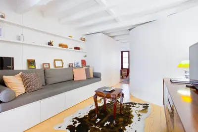 a living room with a couch and a table at Porto Emotions - Caldeireiros in Porto