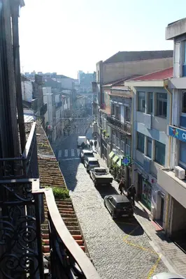 a view of a city street with cars parked at Bonjardim Flats - T1 + 1 com terraço in Porto