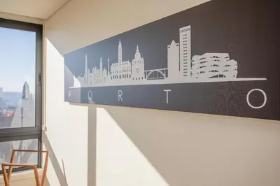 a city skyline wall sticker on a wall in a room at Liiiving in Porto | Downtown View Apartment in Porto