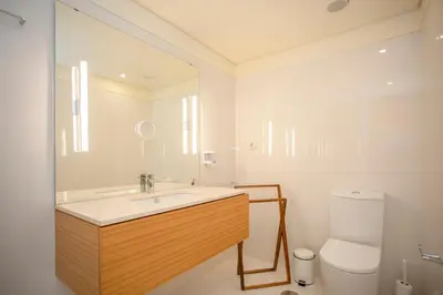 a bathroom with a sink and a toilet at Liiiving in Porto | Downtown View Apartment in Porto