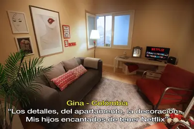 a living room with a couch and a tv at LivingPorto Boavista in Porto