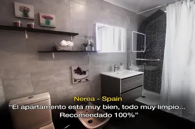 a bathroom with a toilet and a sink at LivingPorto Boavista in Porto