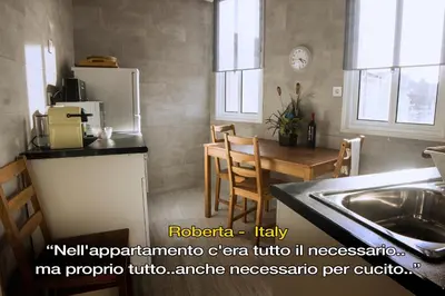 a kitchen with a sink and a table and a refrigerator at LivingPorto Boavista in Porto