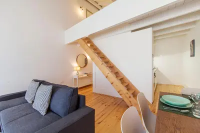 a living room with a couch and a table at Oporto Mezzanine - by ML Apartments in Porto