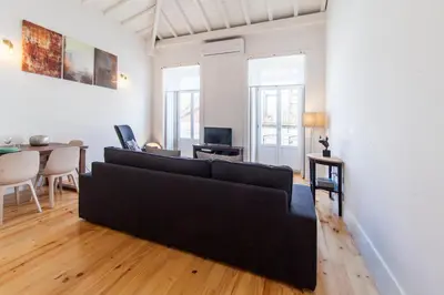 a living room with a couch and a table at Oporto Mezzanine - by ML Apartments in Porto