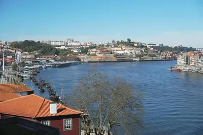 a view of a river with buildings and a city at Porto View by Patio 25 in Vila Nova de Gaia