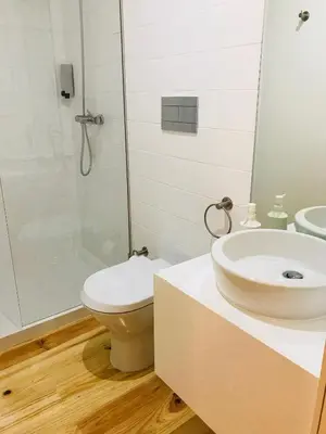 a bathroom with a sink and a toilet and a shower at Porto Ildefonso II in Porto